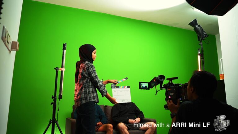 Our behind the scene in the studio with the green screen.
